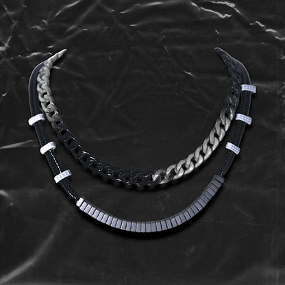 Chockychoker "Chrome Theory" choker featuring a layered structure with a gradient black-to-silver metal chain on the upper tier, and a lower tier composed of black round beads linked by white-grey star-engraved spacers and central matte gradient cube beads. This futuristic accessory channels industrial, cyberpunk, techwear, and alternative streetwear aesthetics. Ideal for unisex fashion, edgy Y2K looks, and bold style statements.


