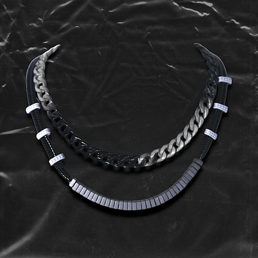 Chockychoker "Chrome Theory" choker featuring a layered structure with a gradient black-to-silver metal chain on the upper tier, and a lower tier composed of black round beads linked by white-grey star-engraved spacers and central matte gradient cube beads. This futuristic accessory channels industrial, cyberpunk, techwear, and alternative streetwear aesthetics. Ideal for unisex fashion, edgy Y2K looks, and bold style statements.

