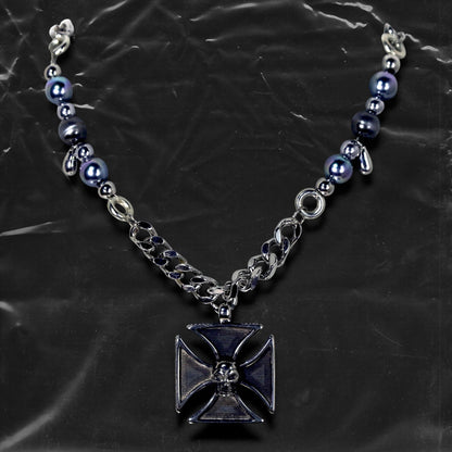 Chockychoker "Knightmare" choker is inspired by the dark knight aesthetic. At its center hangs a black skull-embossed cross pendant, flanked by deep silver and navy-toned metallic pearls intertwined with bold silver chains. The piece embodies a sense of strength and cold elegance, fusing gothic, punk, and Y2K elements. Ideal for those drawn to dark fashion, knightcore fantasy, and layered metallic statement accessories.