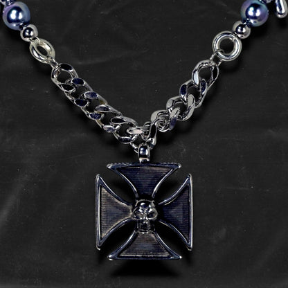 Chockychoker "Knightmare" choker is inspired by the dark knight aesthetic. At its center hangs a black skull-embossed cross pendant, flanked by deep silver and navy-toned metallic pearls intertwined with bold silver chains. The piece embodies a sense of strength and cold elegance, fusing gothic, punk, and Y2K elements. Ideal for those drawn to dark fashion, knightcore fantasy, and layered metallic statement accessories.