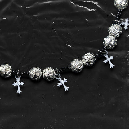 Chockychoker “Nova Chain I” is a Gothic choker necklace featuring white plastic cross charms and silver textured alloy beads, strung with black seed beads. Perfect for alternative, Y2K, punk, goth, and edgy fashion lovers. Statement unisex accessory with dark aesthetic and industrial vibe.
