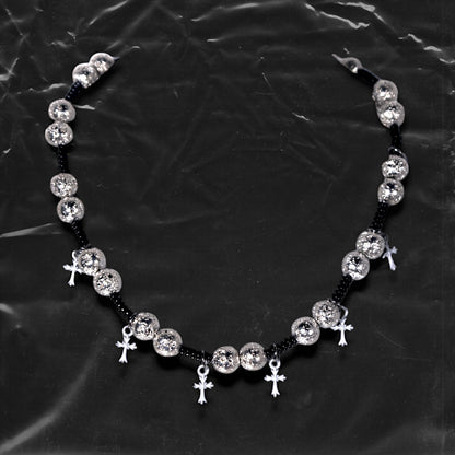 Chockychoker “Nova Chain I” is a Gothic choker necklace featuring white plastic cross charms and silver textured alloy beads, strung with black seed beads. Perfect for alternative, Y2K, punk, goth, and edgy fashion lovers. Statement unisex accessory with dark aesthetic and industrial vibe.
