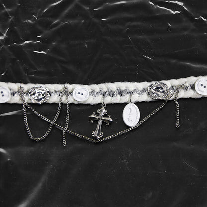 Chockychoker “Milk Galaxy” is a Handcrafted gothic-style choker made from soft white yarn interwoven with shimmering silver thread, adorned with layered silver-tone chains, a central baroque-style silver cross pendant, a mix of glossy white plastic buttons and vintage-style metallic buttons, and white oval resin charms ideal for lovers of gothic, alt, punk, lolita, soft grunge, and romantic street fashion. Perfect for those seeking statement chokers with unique handcrafted details and mixed media textures.