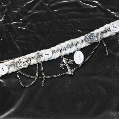 Chockychoker “Milk Galaxy” is a Handcrafted gothic-style choker made from soft white yarn interwoven with shimmering silver thread, adorned with layered silver-tone chains, a central baroque-style silver cross pendant, a mix of glossy white plastic buttons and vintage-style metallic buttons, and white oval resin charms ideal for lovers of gothic, alt, punk, lolita, soft grunge, and romantic street fashion. Perfect for those seeking statement chokers with unique handcrafted details and mixed media textures.