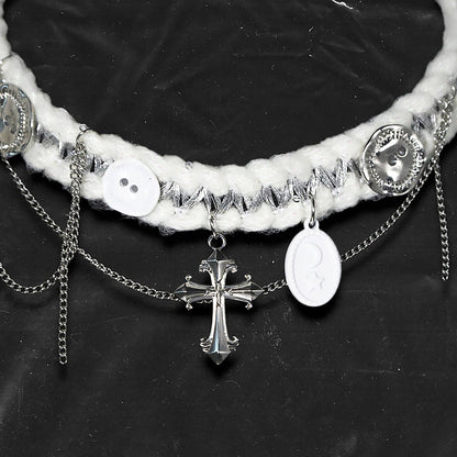 Chockychoker “Milk Galaxy” is a Handcrafted gothic-style choker made from soft white yarn interwoven with shimmering silver thread, adorned with layered silver-tone chains, a central baroque-style silver cross pendant, a mix of glossy white plastic buttons and vintage-style metallic buttons, and white oval resin charms ideal for lovers of gothic, alt, punk, lolita, soft grunge, and romantic street fashion. Perfect for those seeking statement chokers with unique handcrafted details and mixed media textures.